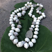 Make a statement with our one of a kind, Haitian Papillion Blanc beaded necklace. Hand strung with handmade beads individually rolled from a variety of recycled, printed paper and semi-precious gemstones.