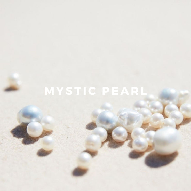 Mystic Pearl is a re­freshing scent, mingling a heady mix of white flowers, jasmine and frangipani, with a hint of coconut and the tropical spices cinnamon and clove.