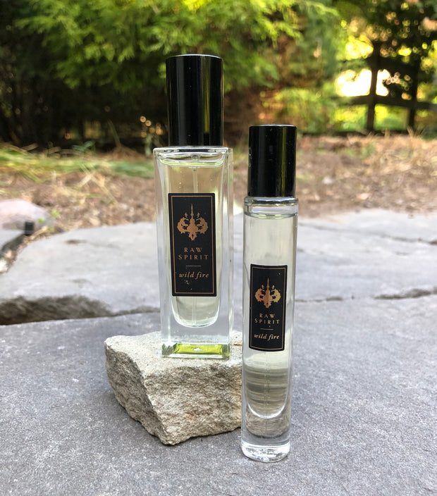 WILD FIRE Unisex Perfume Gift Set, Eau de Parfum Spray and Rollerball - a $125.00 value, yours for $95.00 (you save $30!) A seductive dry, woodsy scent which blends premium wild-harvested Australian sandalwood with creamy amber and floral notes of ylang ylang, jasmine petals, cedarwood and musk.