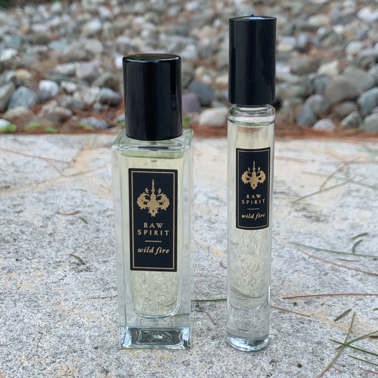 WILD FIRE Unisex Perfume Gift Set, Eau de Parfum Spray and Rollerball - a $125.00 value, yours for $95.00 (you save $30!) A seductive dry, woodsy scent which blends premium wild-harvested Australian sandalwood with creamy amber and floral notes of ylang ylang, jasmine petals, cedarwood and musk.