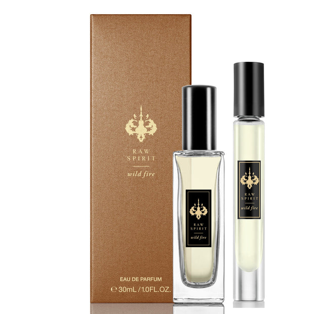 WILD FIRE Unisex Perfume Gift Set, Eau de Parfum Spray and Rollerball - a $125.00 value, yours for $95.00 (you save $30!)  A seductive dry, woodsy scent which blends premium wild-harvested Australian sandalwood with creamy amber and floral notes of ylang ylang, jasmine petals, cedarwood and musk.
